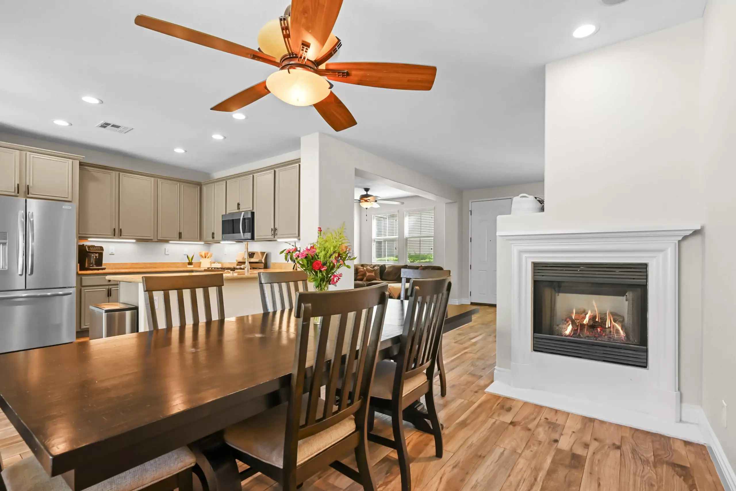 Wildomar real estate photography of a dining table and a fireplace in a house