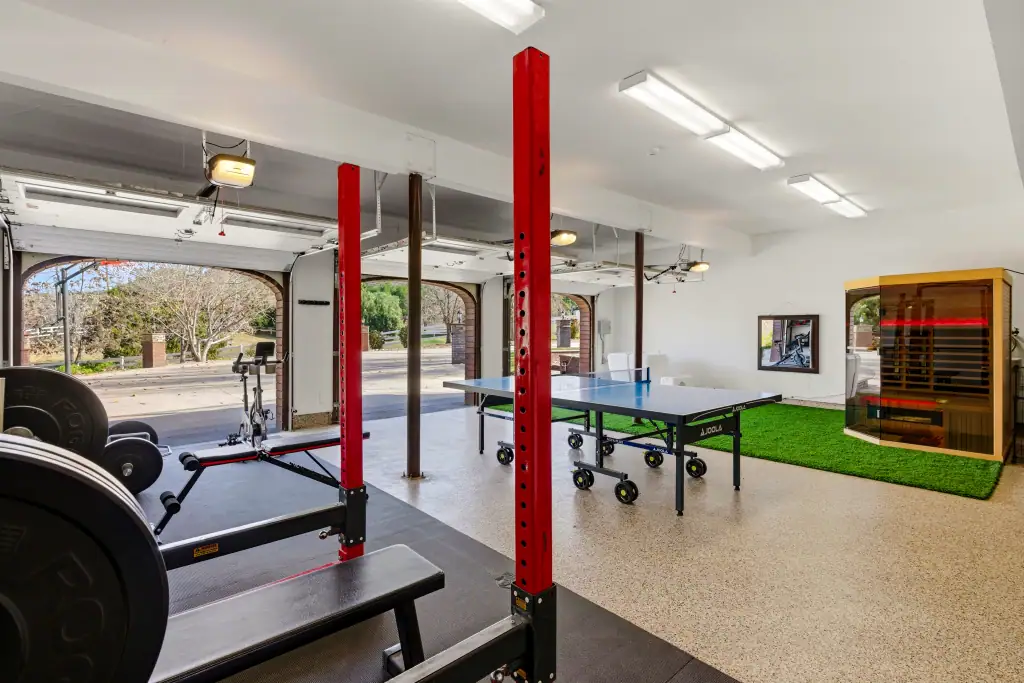 Photography of a garage turned gym.